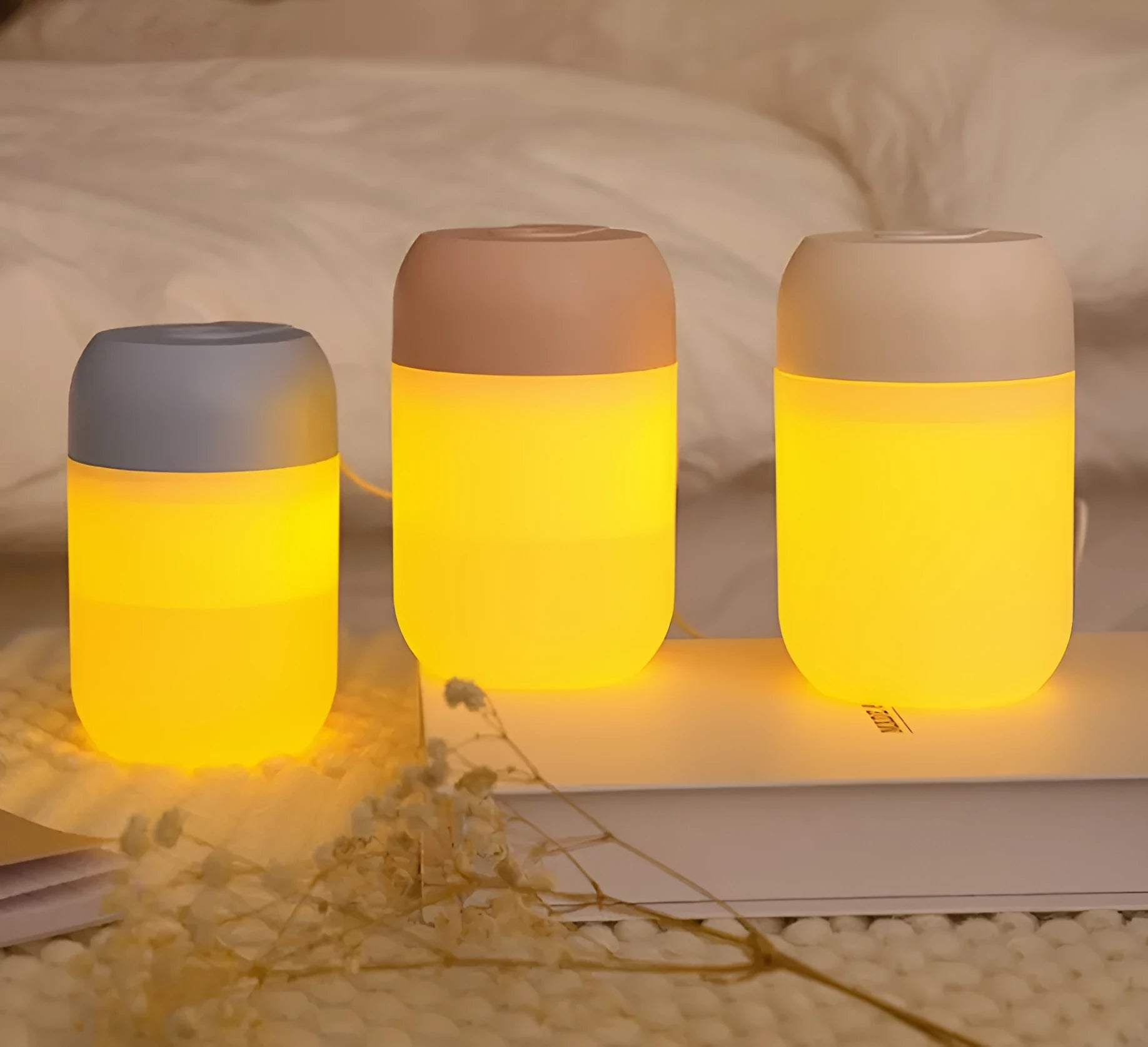White cylindrical USB-powered mini humidifier with aromatherapy function on desk