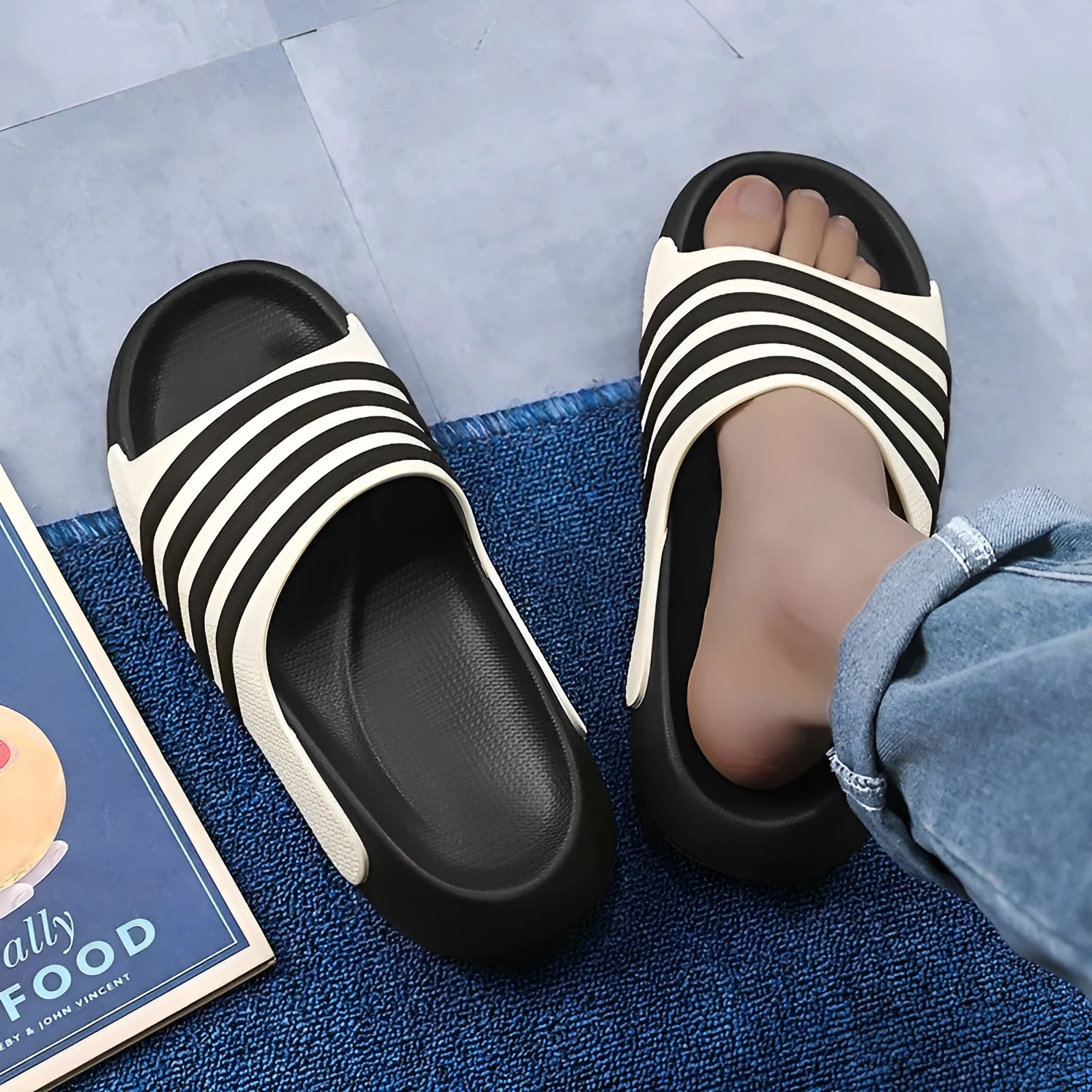 A pair of beige unisex casual sliders with a PVC upper and textured EVA sole.