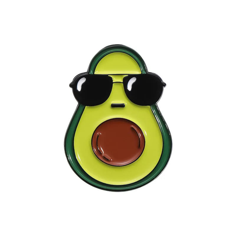 Colourful cartoon fruit design zinc alloy brooch pin on a fabric background.
