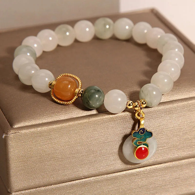 Ice jade women's bracelet with xiangyun peace jade buckle and pearl detailing