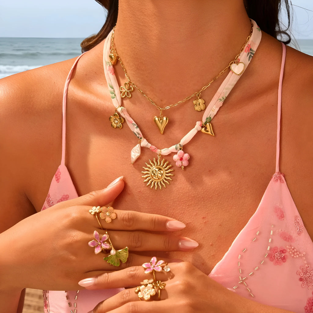 Stainless steel necklace with geometric heart and ribbon sun pendant on adjustable 41-50cm chain