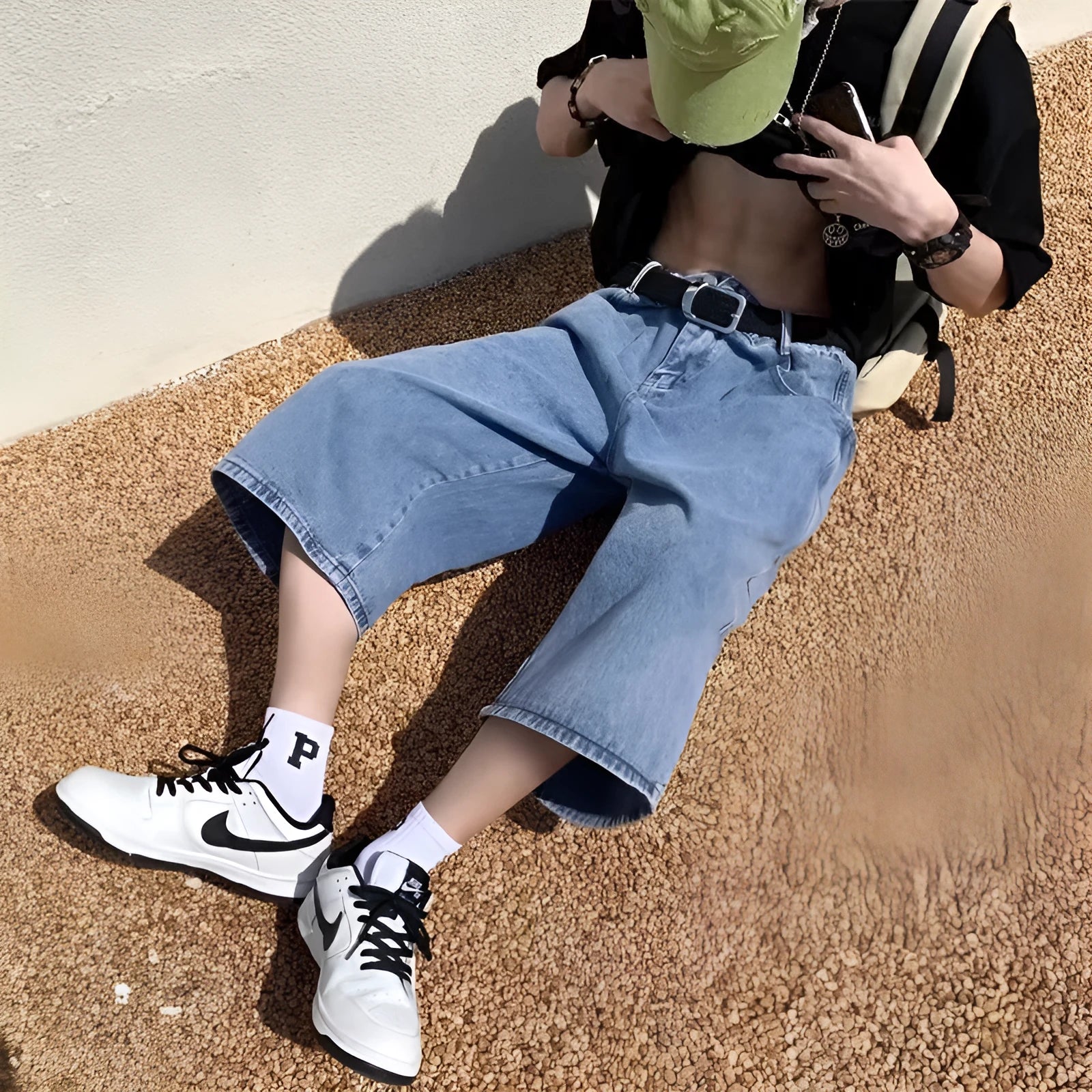 Men's washed blue denim pirate shorts with high-waist and cropped length design