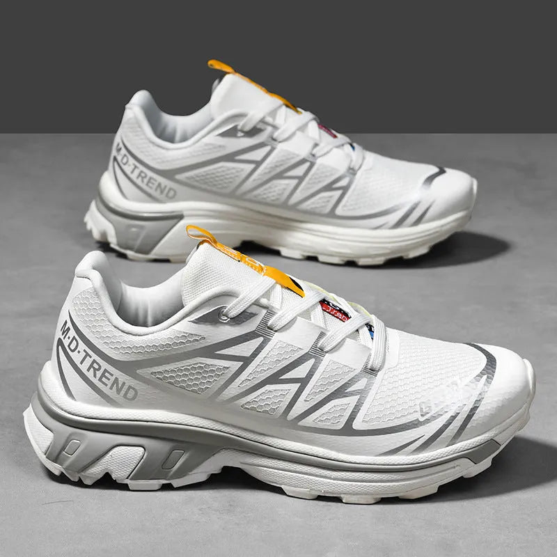 Low-top hiking shoes in artificial leather with mesh lining and a flat rubber sole.