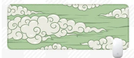 Large cloud pattern mouse pad with non-slip rubber base on a desk