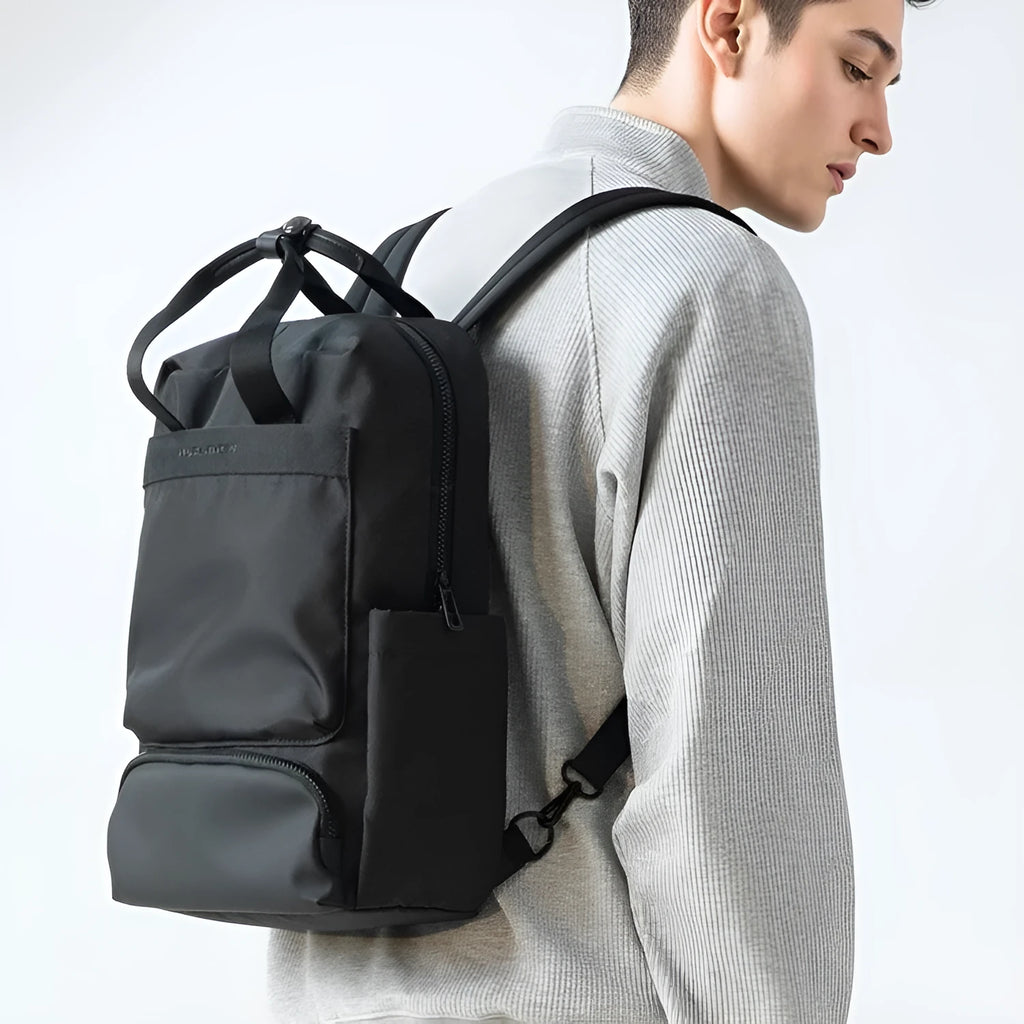 Elegant black Oxford cloth computer backpack showing main compartment and straps