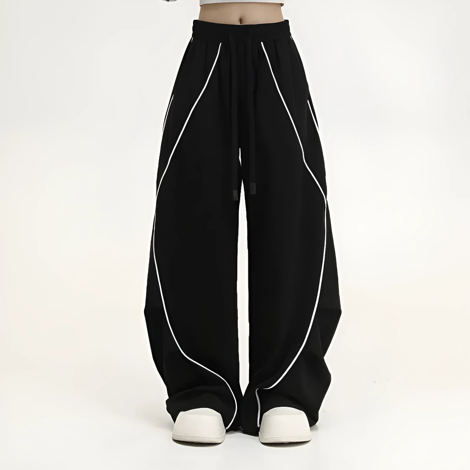 Black striped pleated hip hop sports wide-leg pants on hanger showing loose fit and mid-waist design
