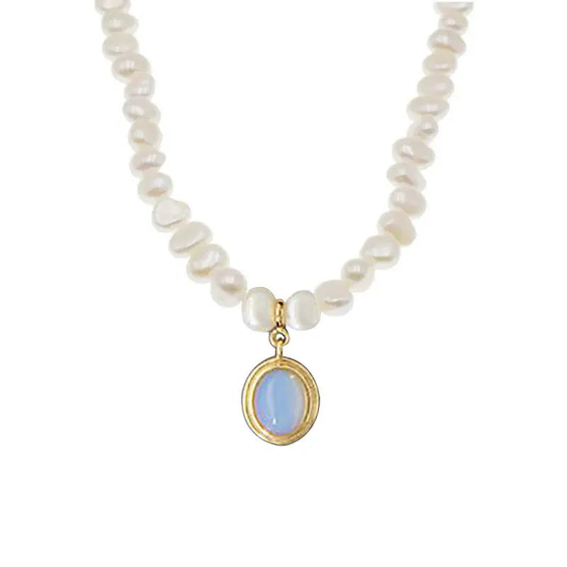 Silver necklace with round medal pendant and irregular freshwater pearls on adjustable chain