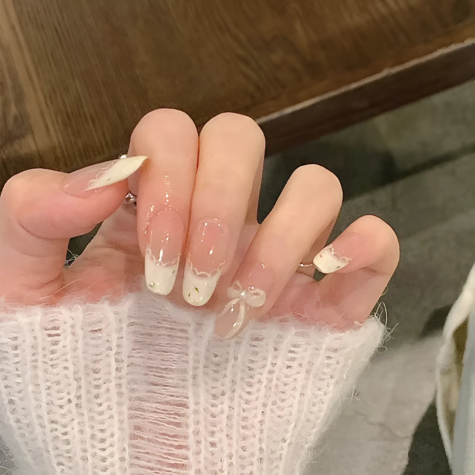 Sweet Girl Wearing Fake Nails press-on artificial nail sets in random colours for DIY application.