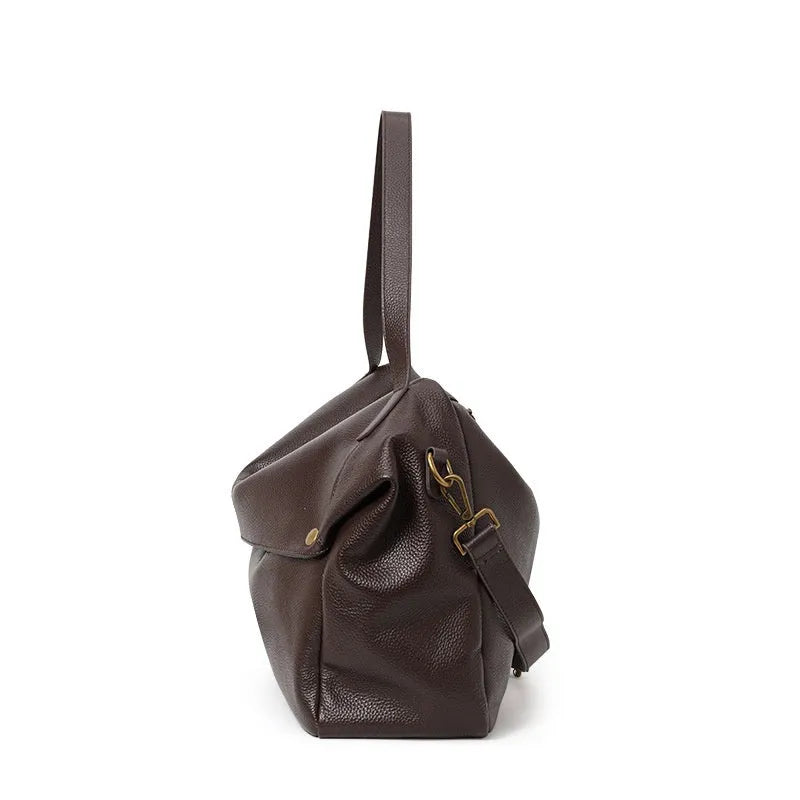Brown genuine leather women's shoulder bag with a square shape and shoulder strap.