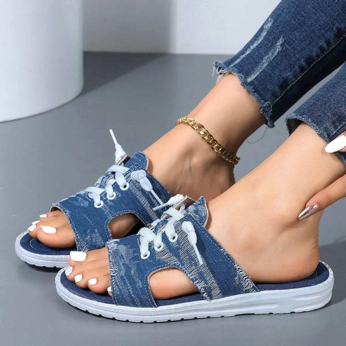 Blue Roman-style women's canvas slippers with cloth upper and rubber sole