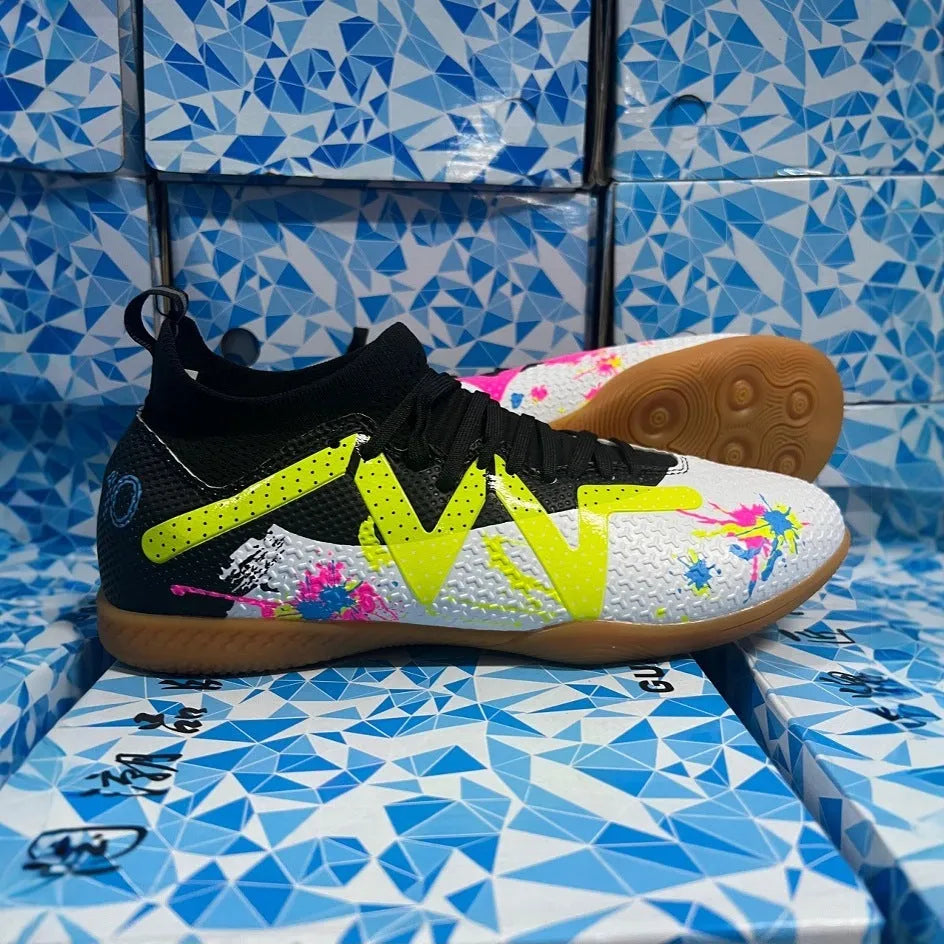 Low-top adult football boots with replaceable studs in Black & Yellow, White Black, and White Powder colour options.