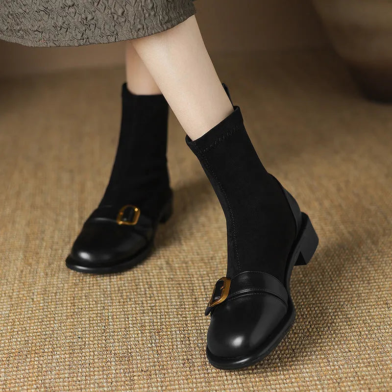 Women's black low heel Martin ankle boots with lace-up front and buckle stitching detail