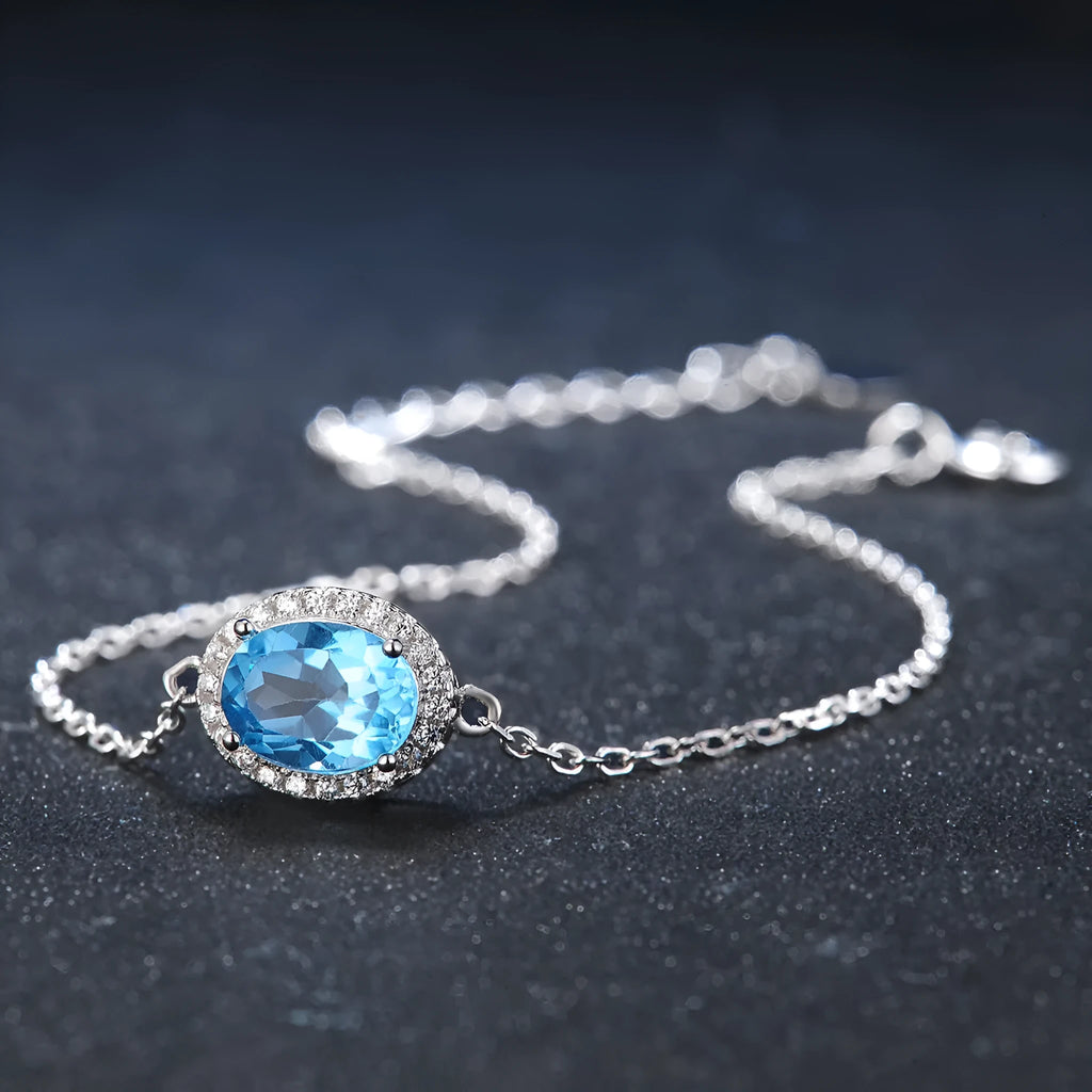 925 sterling silver jewellery set with Blue Topaz stones in geometric design including earrings, ring, pendant and necklace