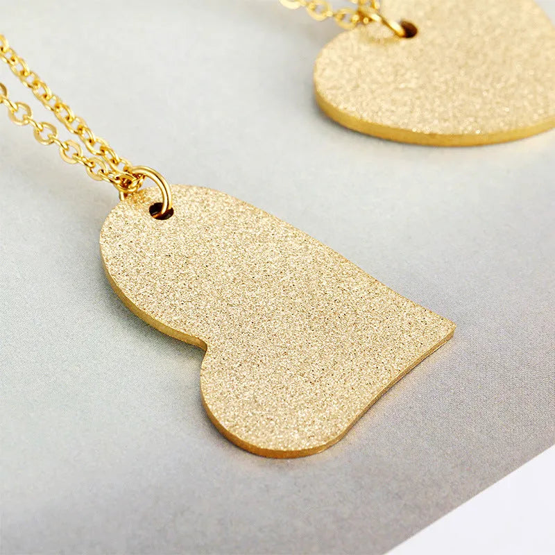 Women's titanium steel geometric heart-shaped pendant necklace in colour KN25736-Z.