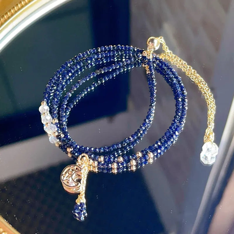 Blue sand stone three-ring multi-layer bracelet with gold-coloured metal detailing and cut stone texture