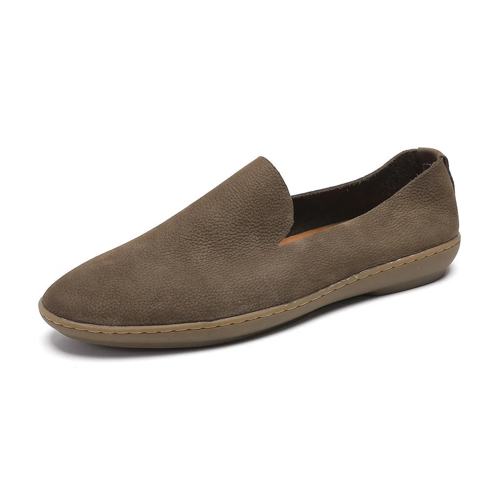 Handmade grey low-top men's casual shoes with a wedge heel and rubber sole on a white background.