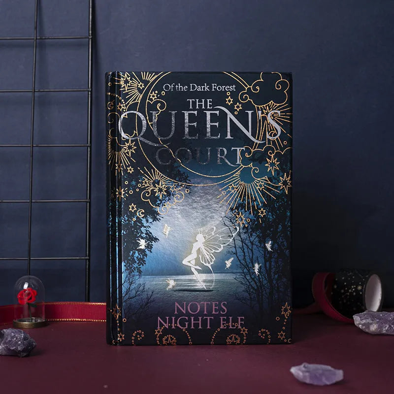 Blue and purple A5 luminous hardcover notebooks with Night Elves design, open to show full-colour illustrated pages.