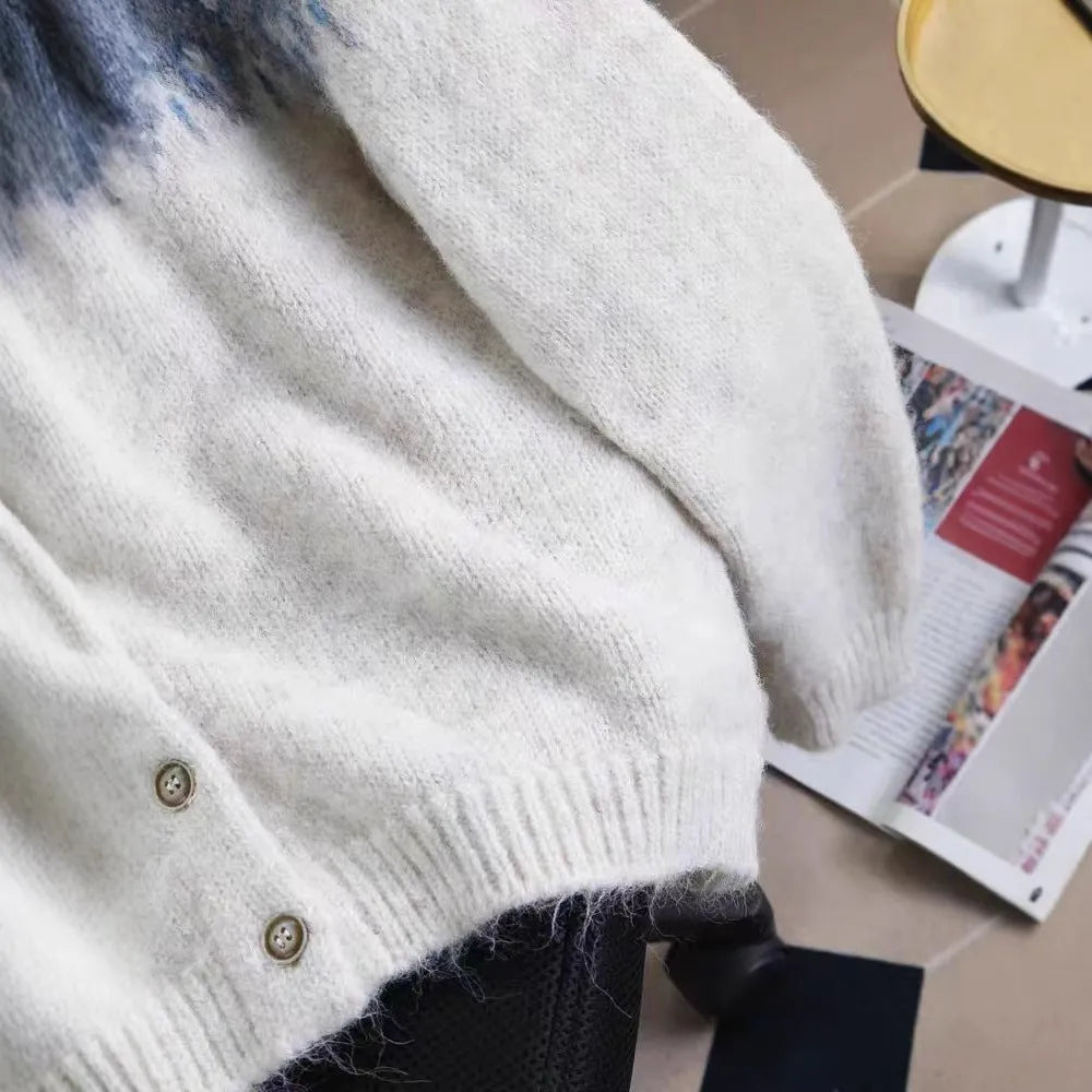 Women's loose-fit jacquard knit sweater coat in beige, shown with long sleeves.