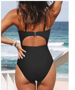 Women's black cross-back one-piece swimsuit with backless design