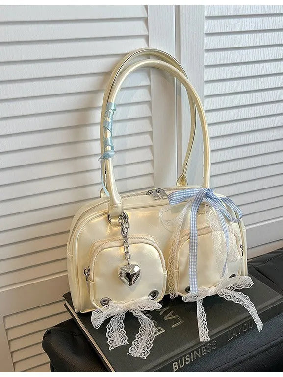 Beige PU shoulder bag with double straps and phone compartment showing structured square shape