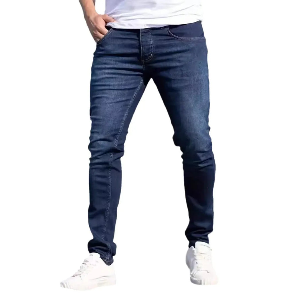 Dark blue men's slim fit casual jeans with medium elastic cotton construction