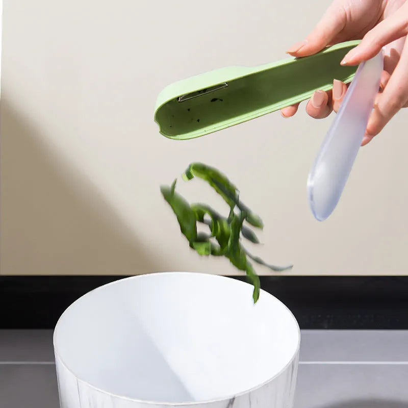 Dark green vegetable peeler with storage tube and stainless steel blade, 20cm length with hanging hole