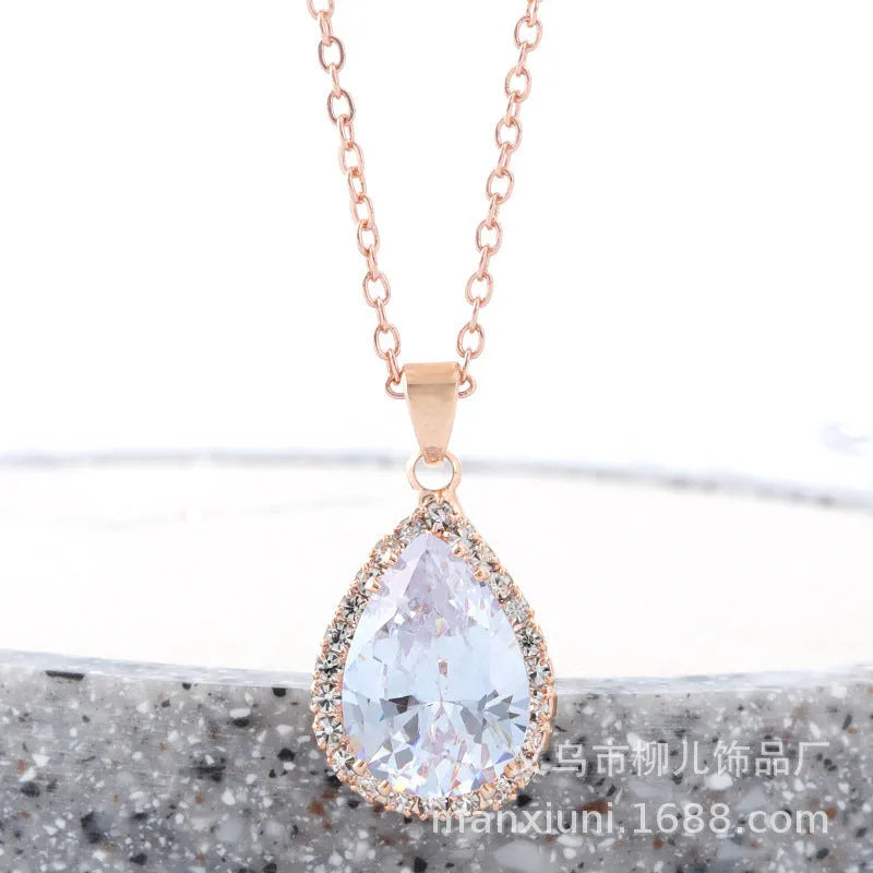 Pink rose gold drop shape rhinestone necklace with geometric design on alloy chain