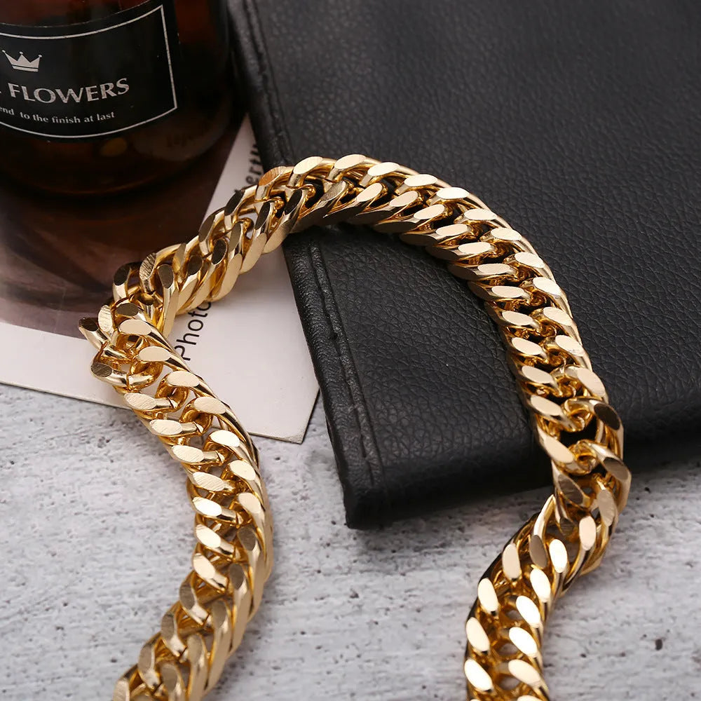 Women's gold chunky chain necklace showing thick links and pendant detail