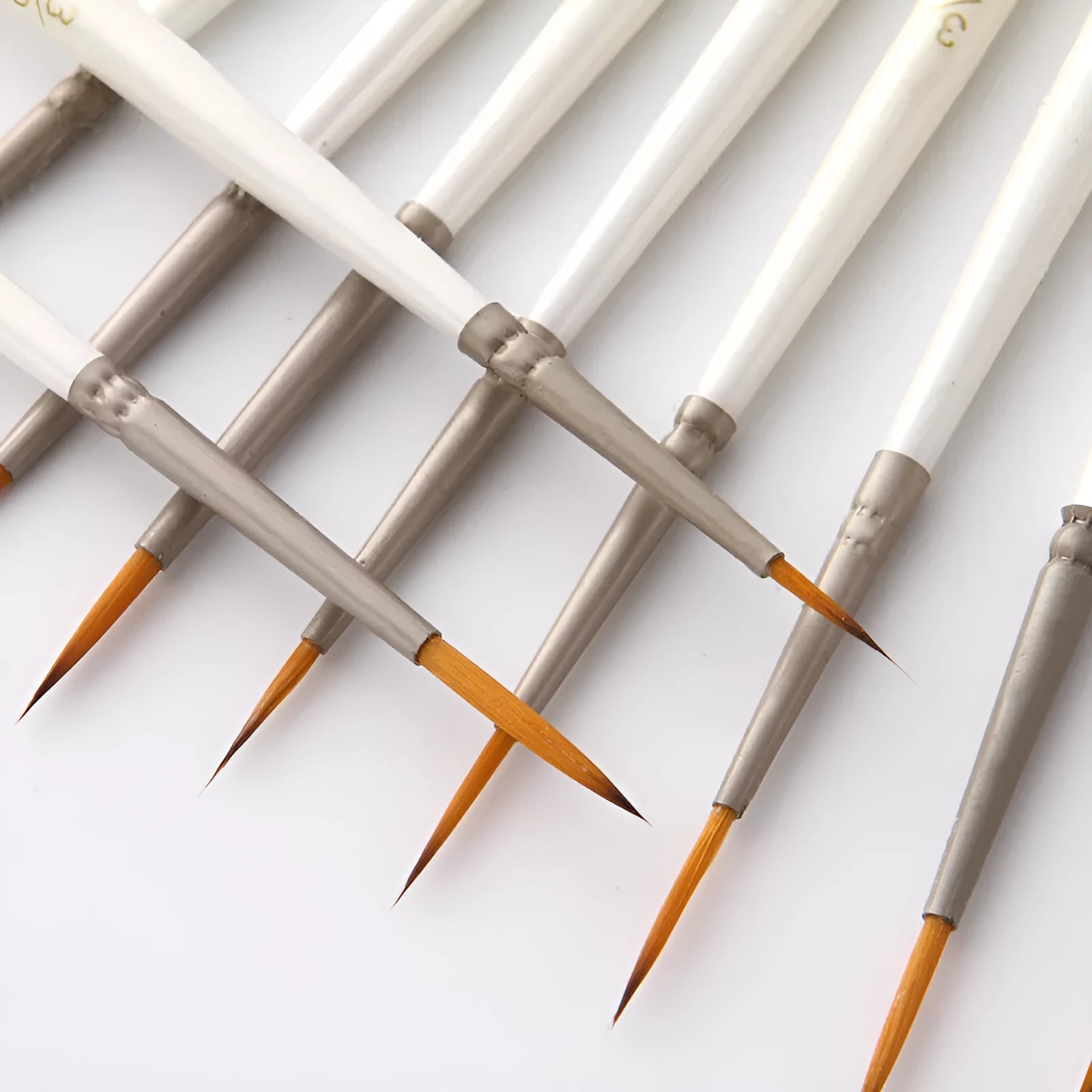 Set of twelve pearl white fluorescent marker pens with nylon wool brush tips and solid wood holders for watercolour art.