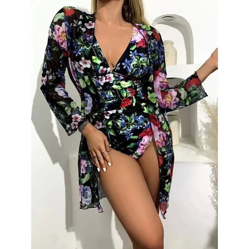 Women's floral print bikini three-piece set with halter-neck top and matching cover-up