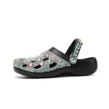 Black women's platform sandals with rhinestone decoration and hole shoe design on an EVA sole.