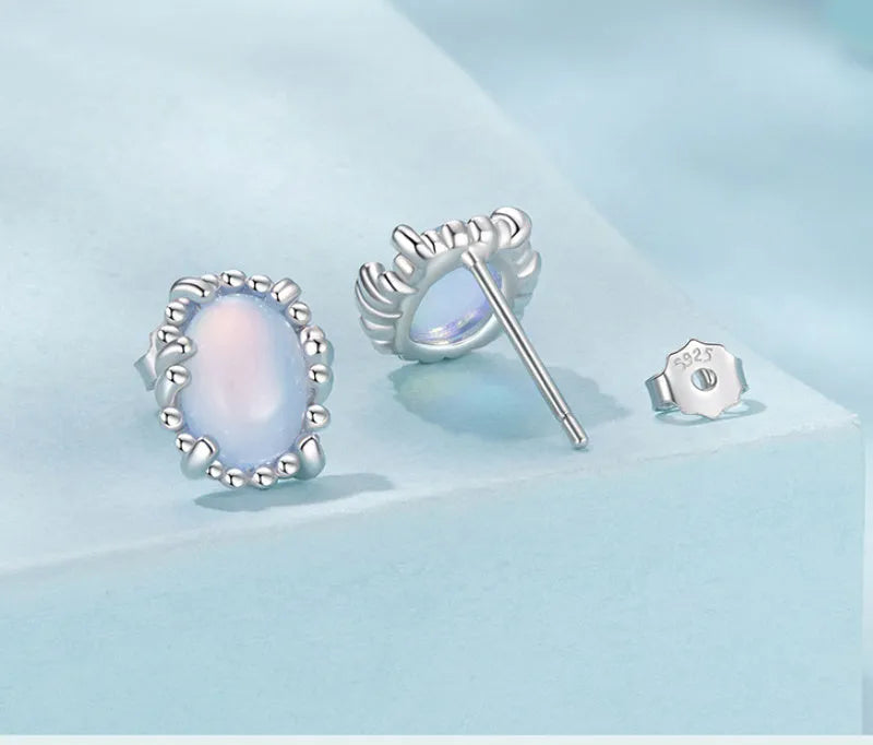 Sterling silver 925 magic stone ellipse stud earrings with French romantic style and electroplated finish