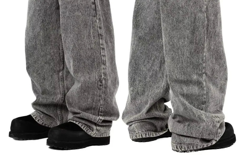 Grey loose fit straight-leg denim trousers for men and women on a mid waist