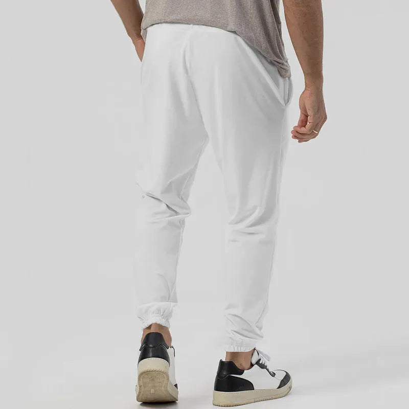 Men's grey cotton blend straight-leg track sweatpants with a tapered fit and elasticated waist.