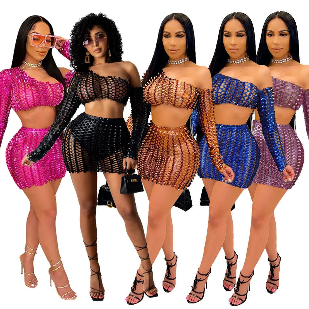 Women's black hollow-out net detail two-piece dress set with sleeveless top and short skirt.