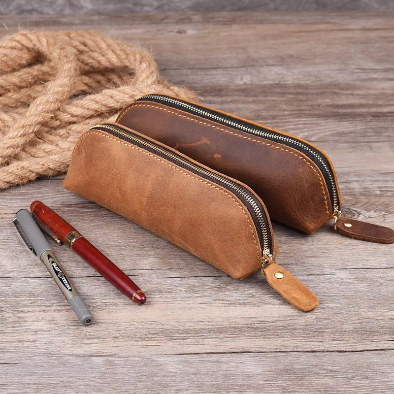 Square leather pencil case with zip closure in black colour showing 18cm dimensions