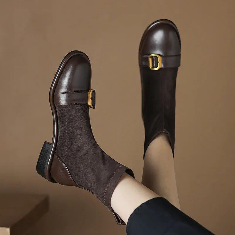 Women's black low heel Martin ankle boots with lace-up front and buckle stitching detail