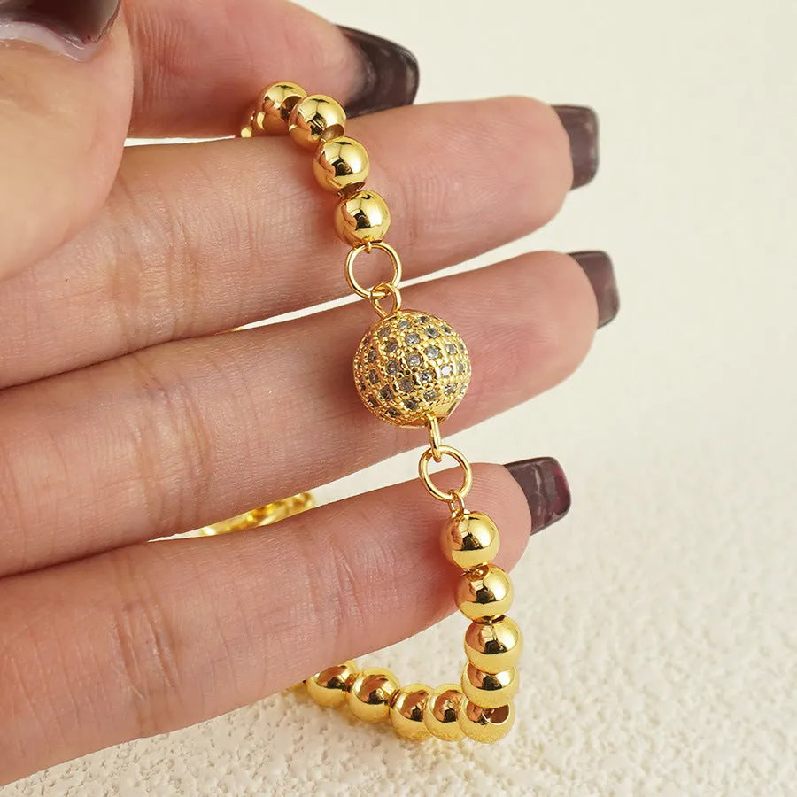 Women's copper bracelet with zircon Arabic styling and heart-shaped pendant on wrist