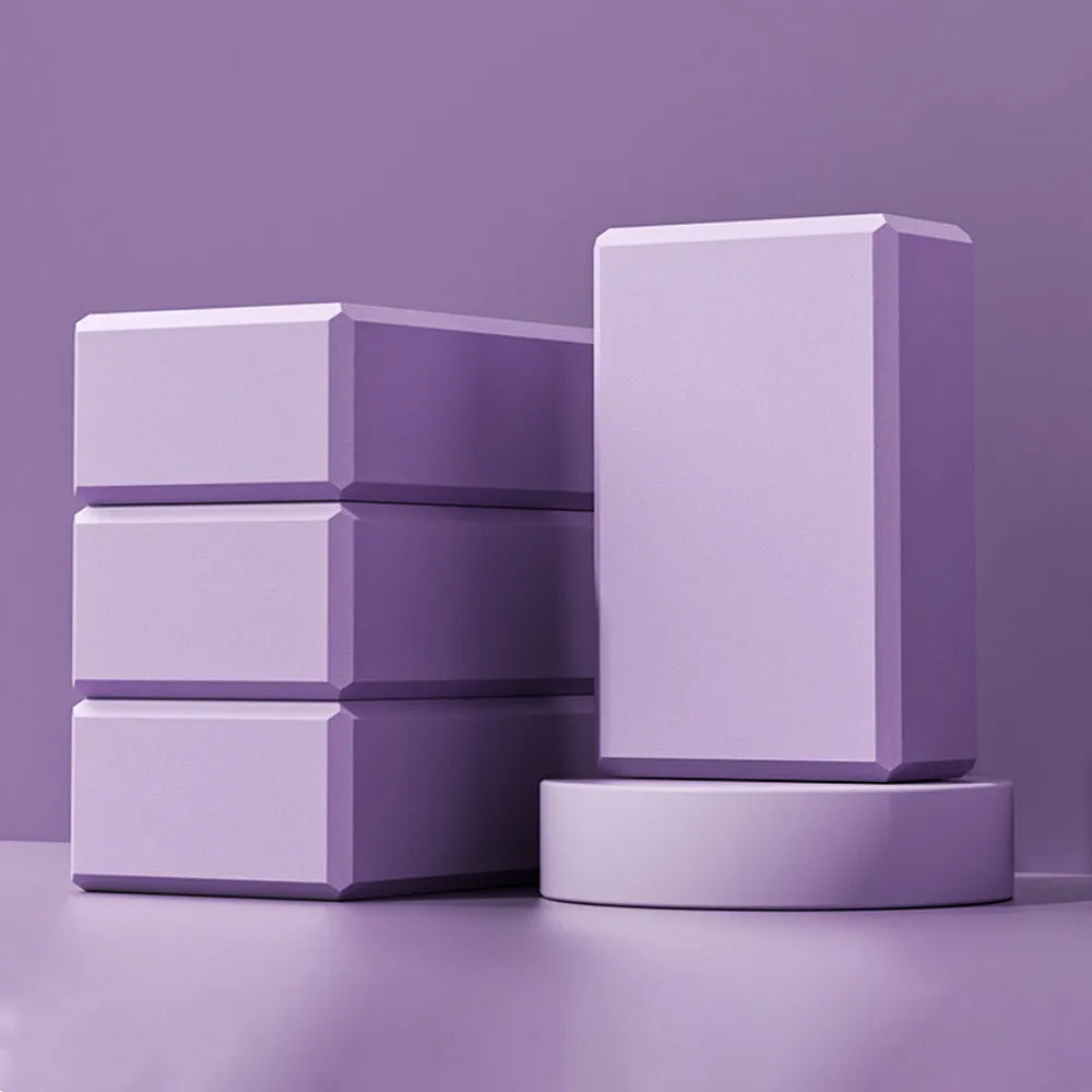 Blue EVA foam yoga brick with hexagonal ridges on surface