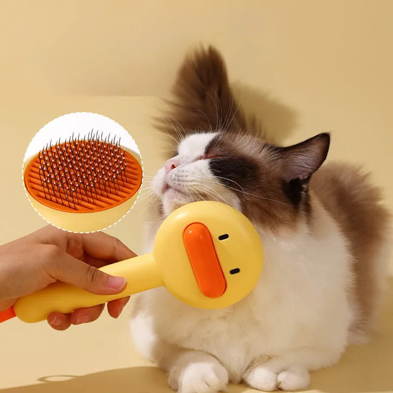 Small yellow duck-shaped pet comb with open and needle teeth for grooming cats and dogs.