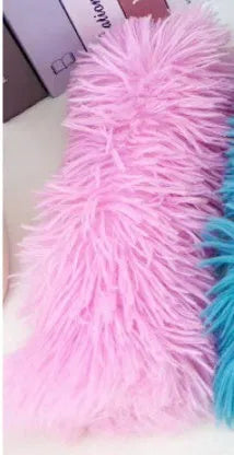 Blue, green, pink, and white plush cat toy pillow measuring 27 by 10 centimetres.