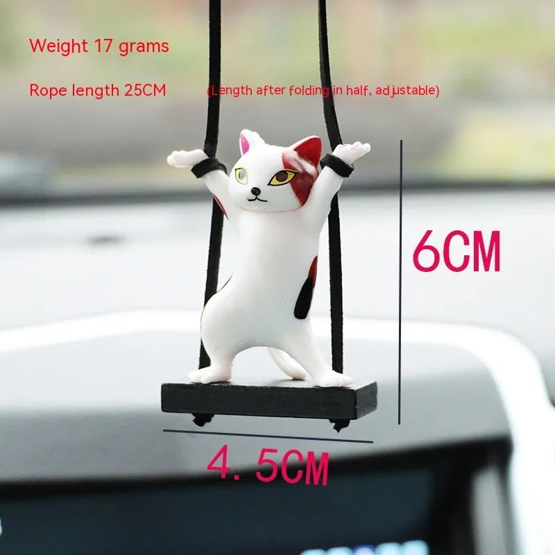 Cartoon-style resin cat pendant on an adjustable rope for car interior decoration.