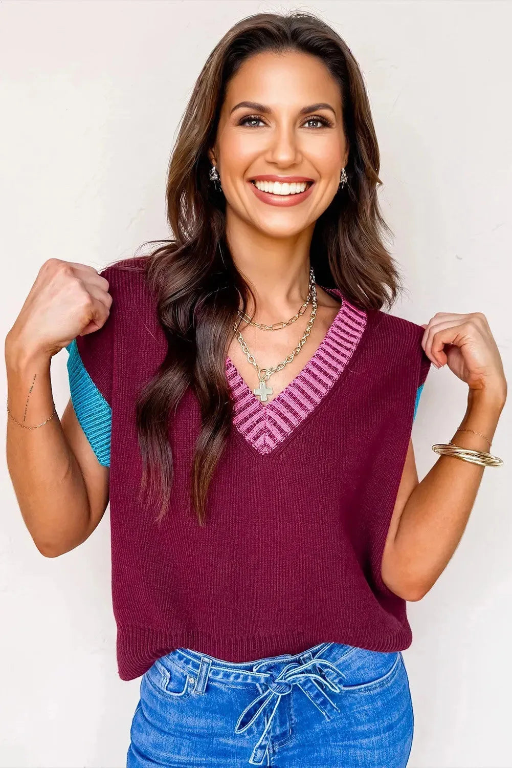 Burgundy loose-fit V-neck sweater with contrast trim on cuffed short sleeves.