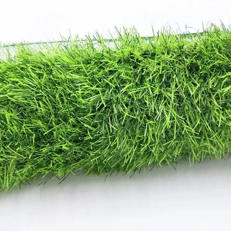 Washable artificial grass pet training mat for dogs and cats on a tiled floor.