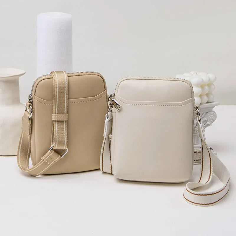 Small solid colour crossbody phone bag for women in beige.