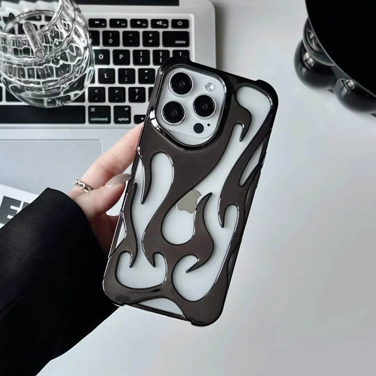 Electroplated hollow flame pattern soft TPU phone case for Apple iPhone in silver finish.