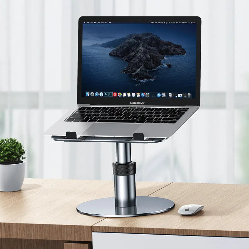 Silver aluminium car laptop stand with adjustable height and rotating base on a car seat.