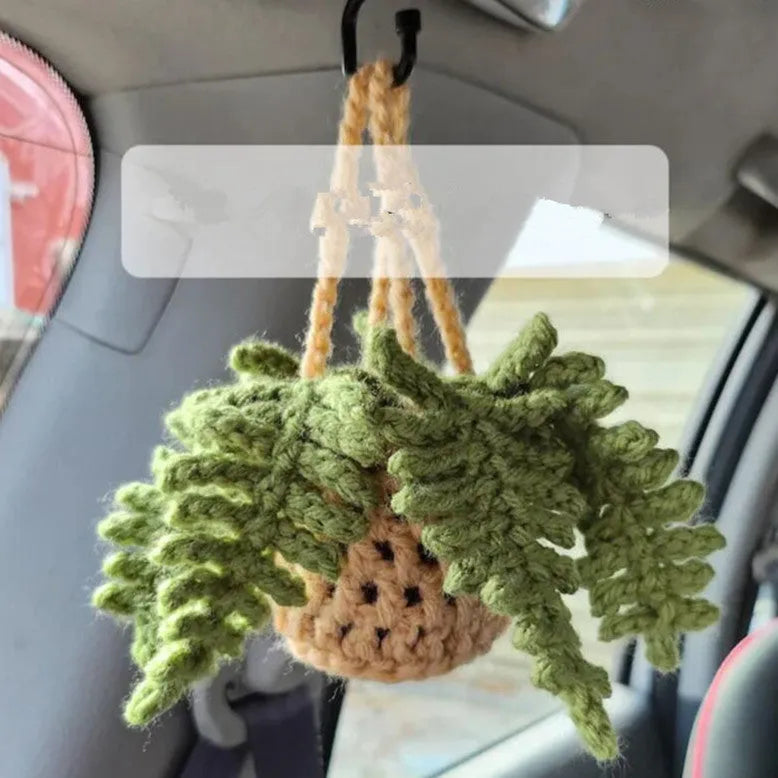 Green and white fish-scale style knitted wool car hanging planter with 8cm base and long white cord.