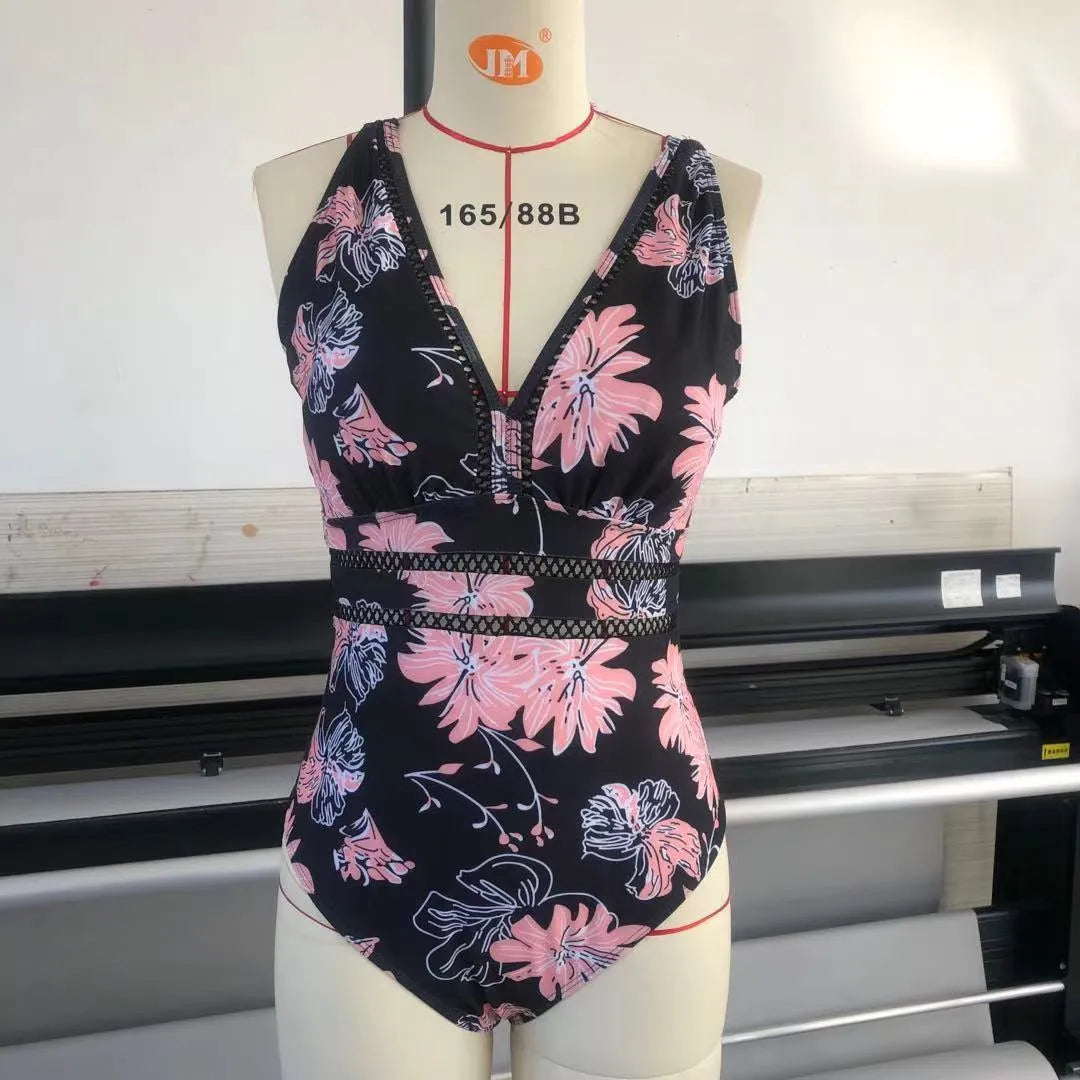 Black printed plus-size bikini swimsuit for women on a hanger.