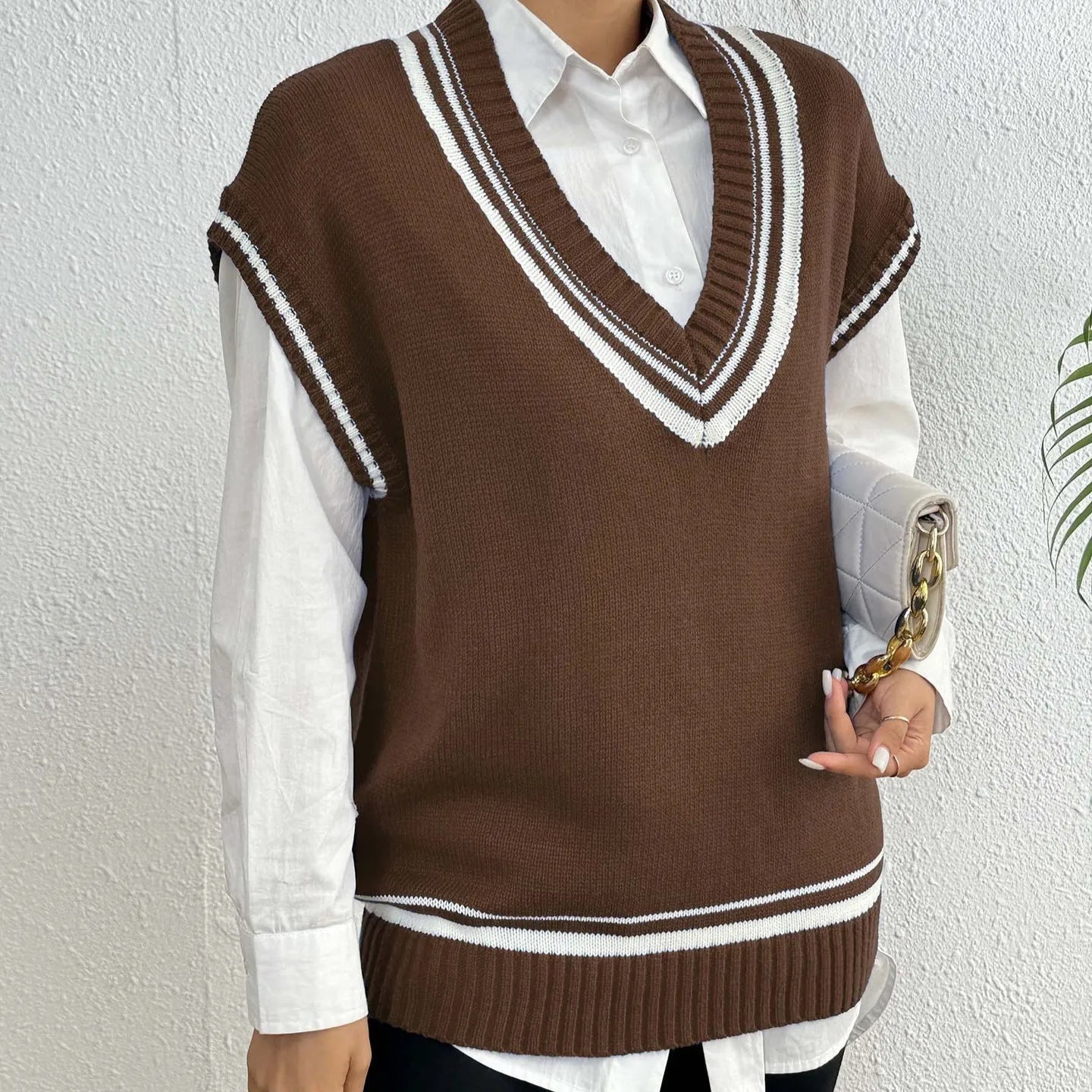 Women's college style wool vest sweater in loose pullover design available in blue coffee black colours